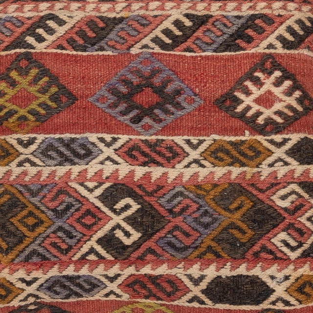 Add a touch of history and warmth to your space with this vintage handmade Turkish wool kilim cushion cover. Crafted from...