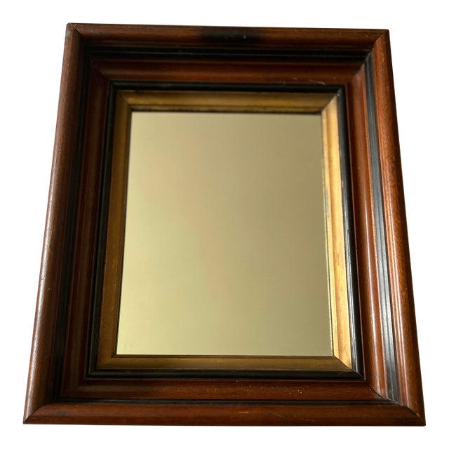 This antique mahogany deep shadow box frame has an inserted mirror and features gold and ebonized details. Solid wood...