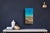 This mixed media piece on wood panel captures a serene coastal scene, where vibrant blues transition into golden sandy...