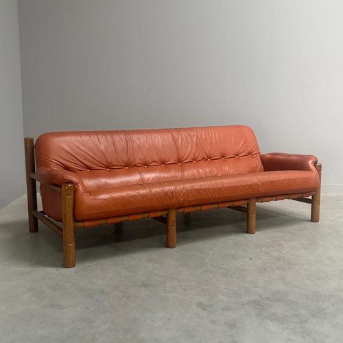 Remarks: Mid century lounge sofa, Germany 1960s. Design in Brutalist and Brazilian style. Solid oak frame with cognac...