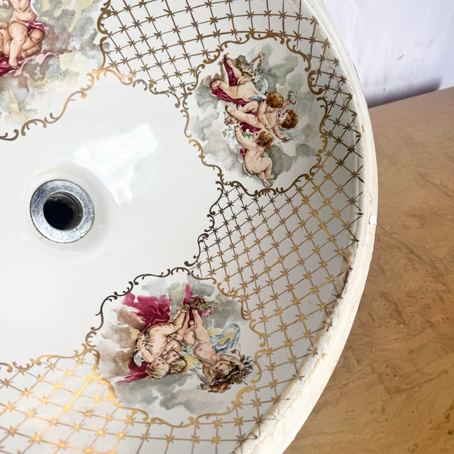 A refined example of Italian artisan porcelain, this vintage Cesame sink features exquisitely hand-painted cherubs framed...