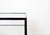 Condition: Original paint and glass top. Moderate signs of wear. The bar cart offered here was designed by Herbert Hirche...