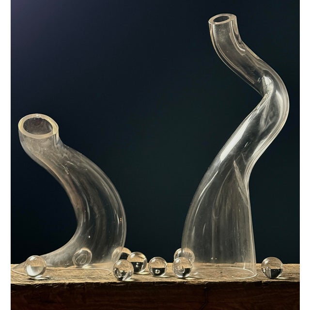 A postmodern biomorphic glass sculpture set, created during the 1980s–90s. Includes two larger sculptural forms accented...