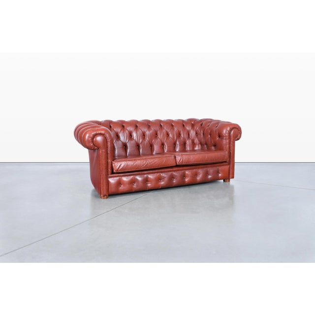 A timeless icon of traditional design, this vintage leather Chesterfield loveseat embodies the enduring appeal of classic...