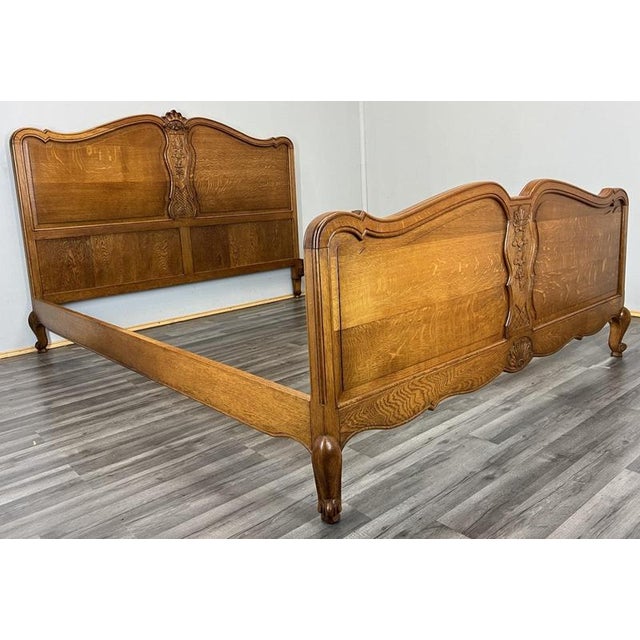 This impressive Vintage French Louis king size bed frame showcases elegant proportions, flowing curves, and refined carved...