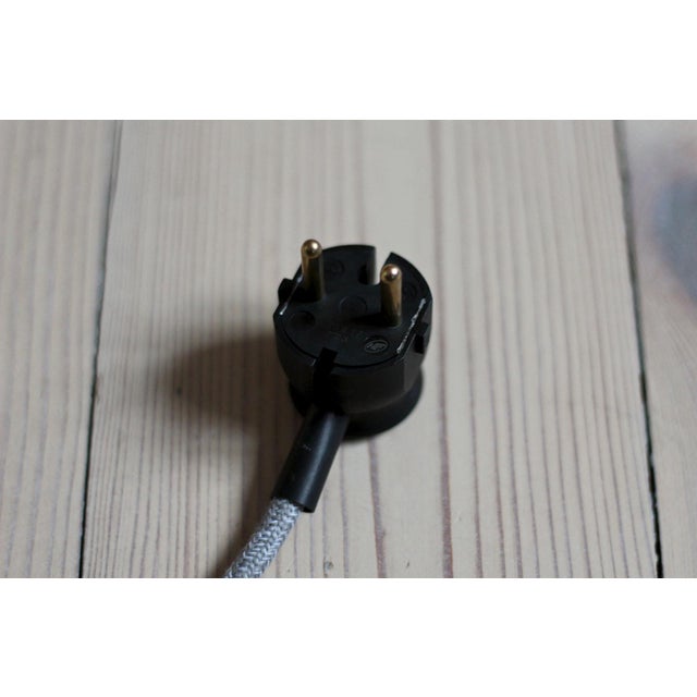 This 1960s floor lamp was made by czech manufacturer uluv (ustredi lidove a umelecke vyroby). It has a large milk-white...