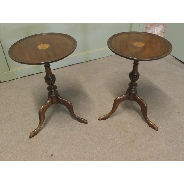 A Pair of Tripod Wine Tables with Decorative Inlay This is a very attractive pair of wine tables, they stand on a slender...
