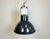This industrial lamp was made by mazda in france during the 1960s. It features a dark blue enamel shade with white enamel...