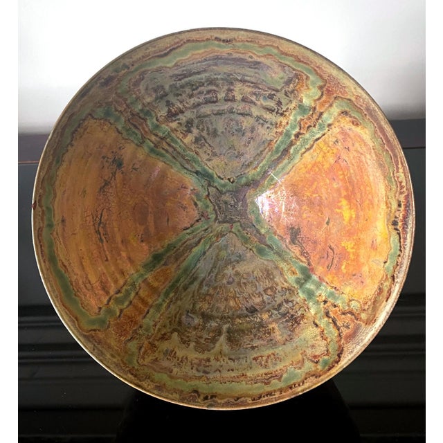A large ceramic lusterware bowl by American artist and studio potter Beatrice Wood (1893-1998). The piece, circa 1980s, is...
