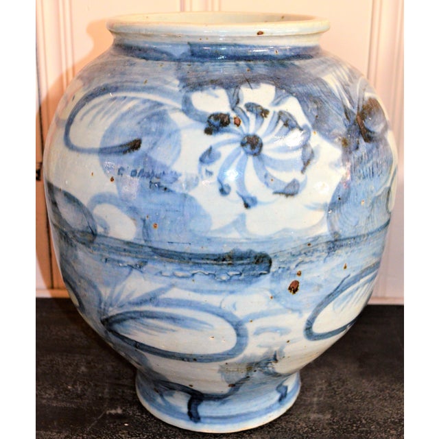 This is a beautiful blue and white large rounded abstract lotus flower porcelain vase. This has an amazing design and...