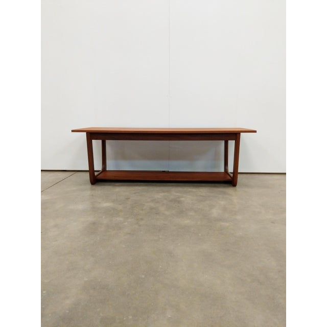 Authentic vintage mid century modern teak coffee table. This piece is in excellent condition with very few signs of age-...