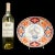 A large colorful hand painted oval porcelain bowl with scalloped edged and painted with a central design of a bonsai pot...
