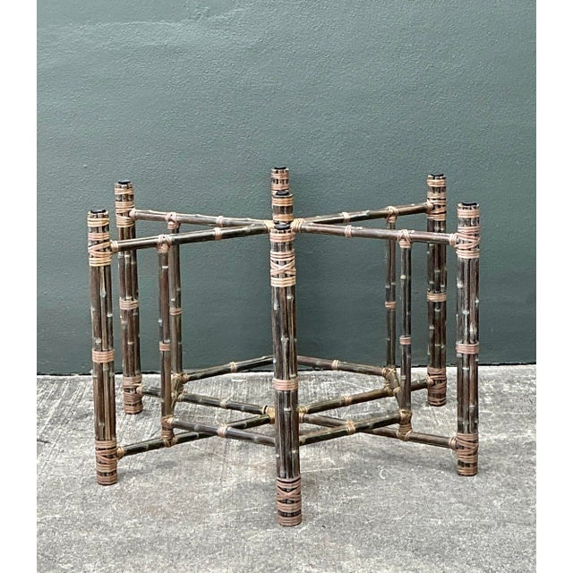 This striking vintage dining table pedestal pays homage to the iconic bundled rattan aesthetic pioneered by McGuire of San...