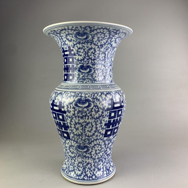 This impressive vase features a classic "Phoenix Tail" silhouette, characterized by a wide, flared trumpet mouth, a...