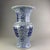 This impressive vase features a classic "Phoenix Tail" silhouette, characterized by a wide, flared trumpet mouth, a...