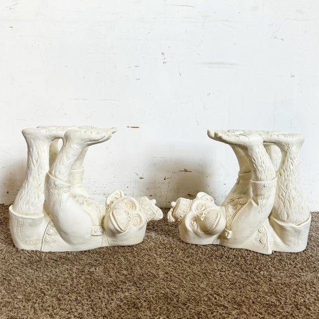 Add a whimsical touch to your space with this Vintage Regency Plaster Monkey Tables by Continental Accents - A Pair....