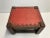 Bohemian low stool with red patterned vinyl seat in fair condition