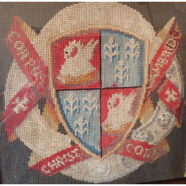 An Antique (circa late 1800s) Needlepoint Tapestry depicting the Heraldry, symbol for Cambridge University, College. The...