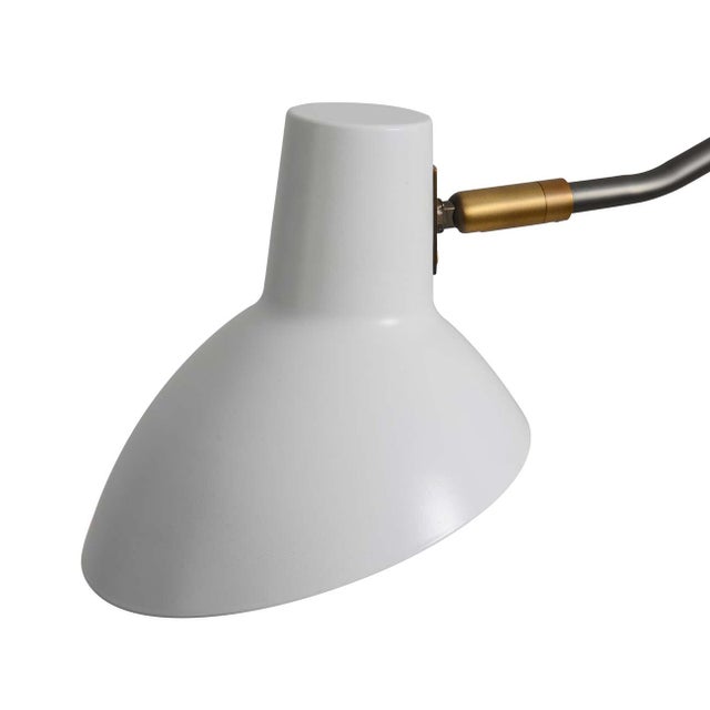 Elevate your space with the elegant contemporary style of the Swing Wall Sconce. This timeless fixture features...