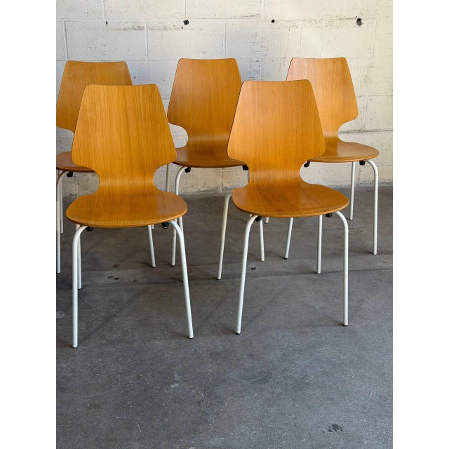 Beautiful set of 8 vintage Danish modern dining chairs featuring sculptural bentwood seats with clean minimalist lines and...
