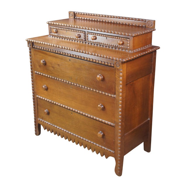 Antique Victorian stepback dresser / chest of drawers. Made of walnut featuring Arts & Crafts styling with five hand...