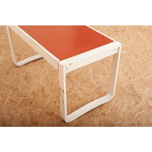 Child's Desk with White Molded Wood Legs and Wood & Red Linoleum Top, 1950s or 1960s, in Worn conditions. Designed 1950 to...
