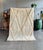 Bring the charm of Moroccan craftsmanship into your home with this stunning Beni Ouarain-style wool rug. Handwoven by...
