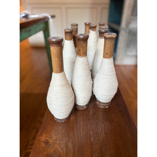 A wonderful collection of 12 authentic vintage wooden textile bobbins from the historic Knoxville Sock Factory, each...