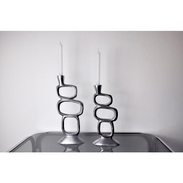 Pair of circle candlesticks designed and produced by matthew hilton in england in the 1980s. Set of two brutalist-style...