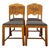 Vintage set of four oak dining chairs featuring carved decorative backrests with stylized scroll and foliate-inspired...