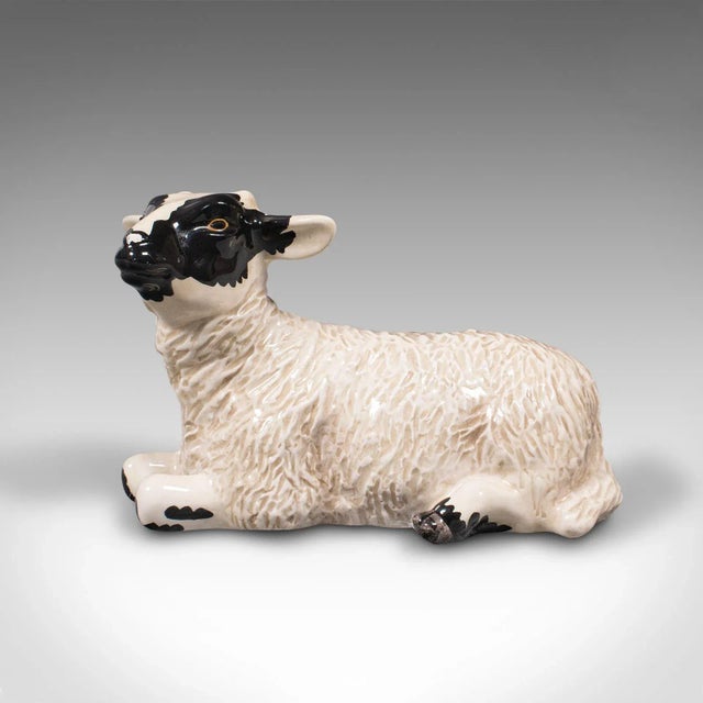 This is a small vintage decorative lamb. An English, ceramic livestock figure by Beswick, dating to the late 20th century,...
