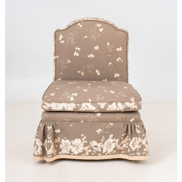 Floral Upholstered Low Slipper Chair, in beige and white. 27" H x 21" W x 18.5" D; seat: 14" H. Provenance: From an East...