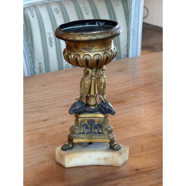19th century Italian Grand Tour bronze urn with a flared rim chased with a band of palmettes over a gadrooned bowl, raised...