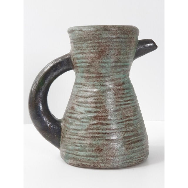 Very good condition. Height 20.5 cm. Length 21 cm. Width 13.8 cm. Very beautiful pitcher.