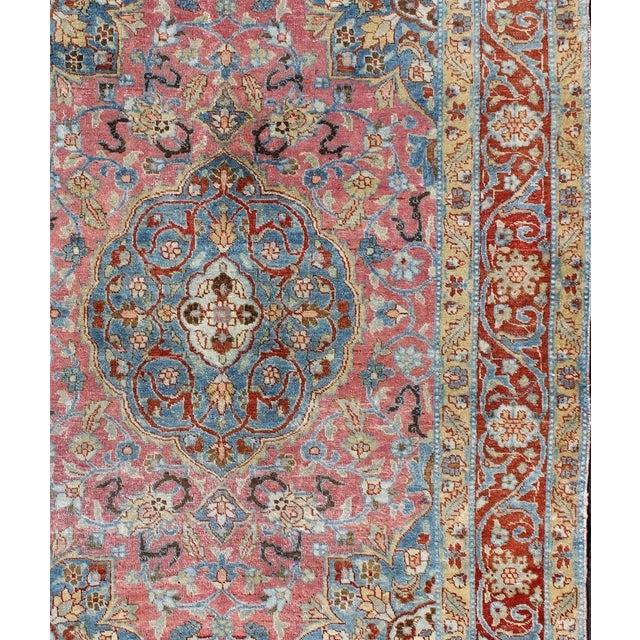 Measures: 4'7 x 6'4. Antique Persian Tabriz Rug with Medallion in Soft Rose, Sky Blue, and Rust Red. Keivan Woven Arts /...