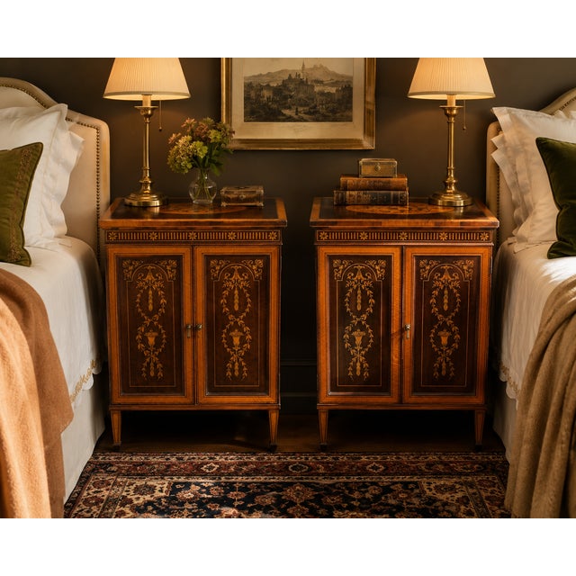An elegant pair of early 20th century Federal Revival bedside cabinets showcasing finely detailed marquetry, satinwood-...