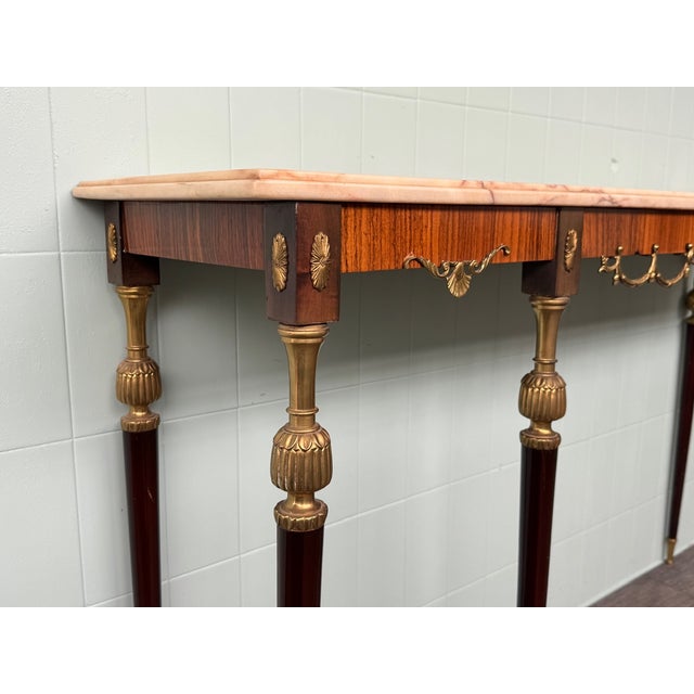 Vintage console made in Italy in the 1960s. Elegant piece of furniture with a beech wood structure, with walnut veneer....