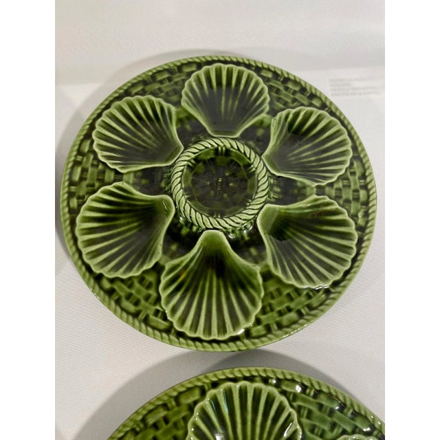 A beautiful French Majolica Longchamp glazed oyster plate in a vibrant emerald green color from circa early 1920s. The...