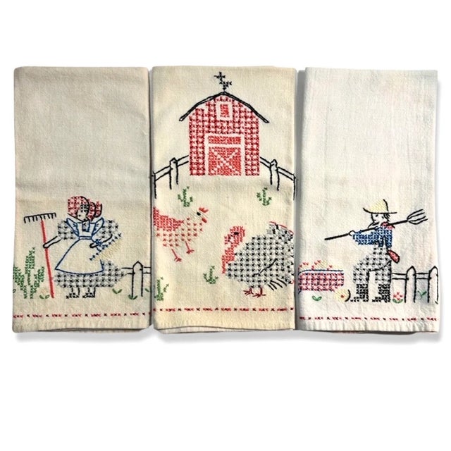"This charming set of three vintage tea towels from the 1940s captures the essence of farmhouse life with delicate hand-...