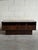 This beautiful low-profile chest presents a rectangular silhouette sitting on a recessed plinth base. Three stacked...