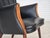 1970s, Danish design by Svend Skipper. Armchair, model "Teddy". Original black artificial leather, teak wood legs, beech...