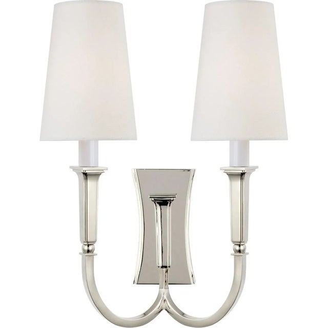 Delphia Large Double Arm Sconce in Polished Nickel with Linen Shade Designer: Thomas O'Brien Height: 17" Extension: 6.5"...