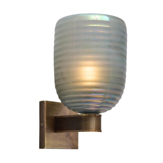 Pair of sconces from Murano island outside of Venice, Italy. These sconces have a brass structure with an antique bronze...