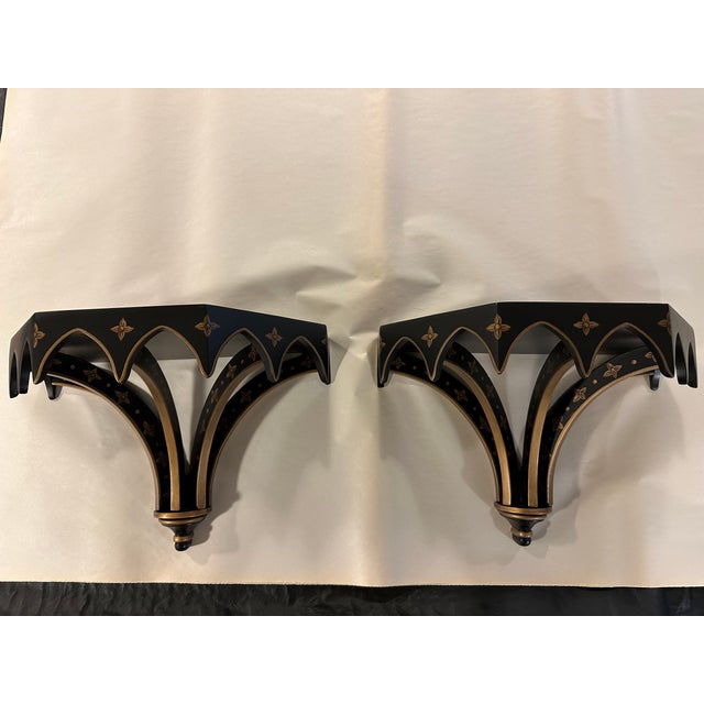 Pair of waxed, black, wooden brackets with decorative gold accents. Elegant style and craftsmanship with timeless Brighton...