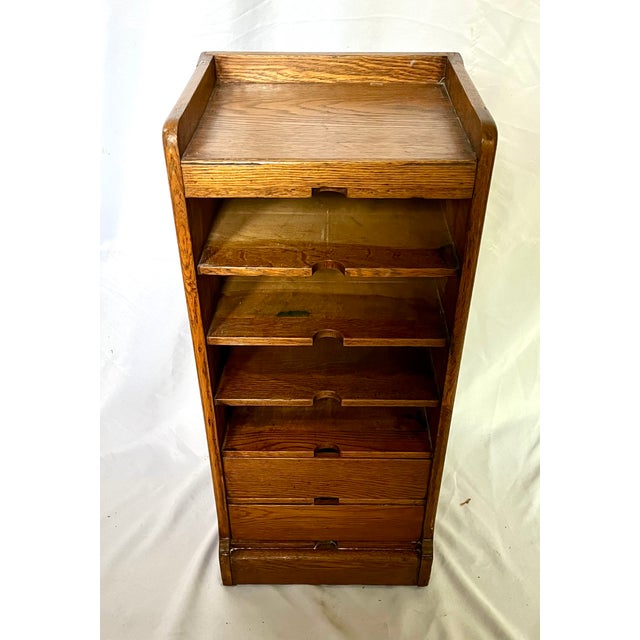 Antique oak letter file cabinet. Created by Commercial Letter File Company of Chicago Illinois. The cabinet features both...