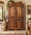 Warm and character-rich vintage Mexican pine armoire featuring Spanish Colonial / hacienda-inspired styling, paneled...