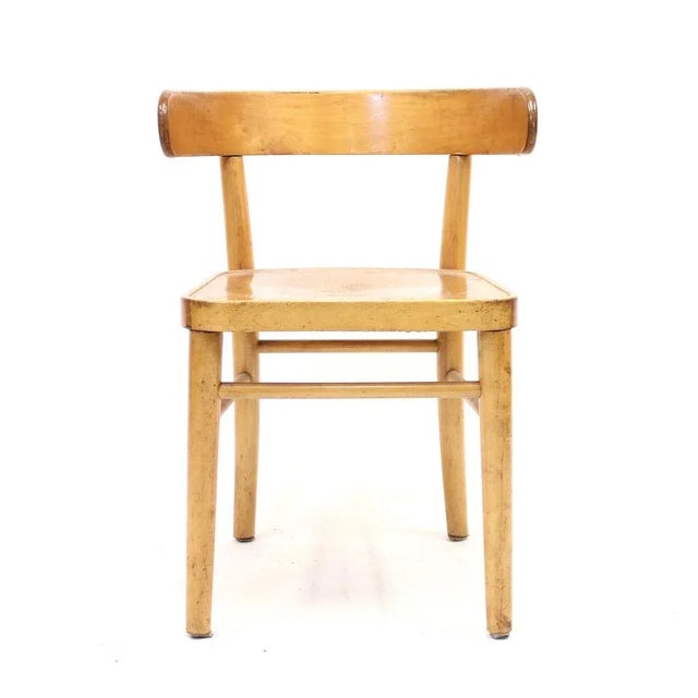 A so called Hugging chair designed by Finish designer Werner West in the 1940s and manufactured by Wilhelm Schauman in the...