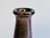 Handcrafted bottle-neck vase by Jürgen Riecke (1927-1997), created in the 1960s. The characteristic ruby-red-brown glaze...