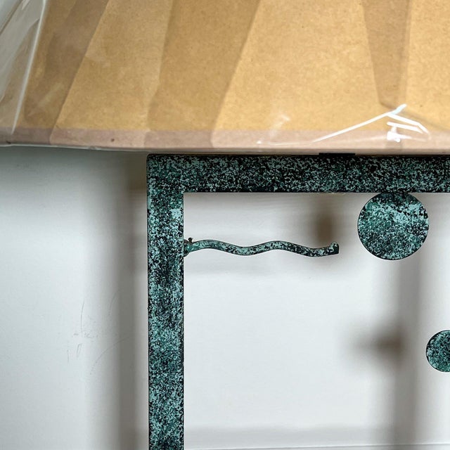 Exceptional pair of modern iron table lamps featuring wavy motif with spheres a faux verdigris finish. A rare example of...