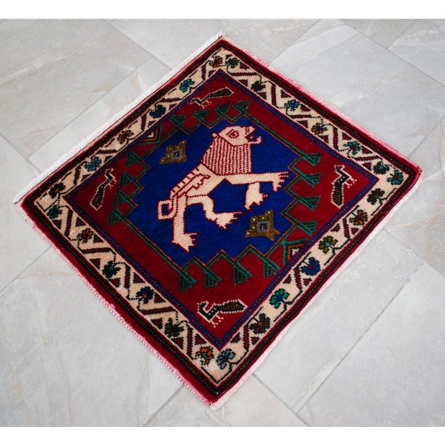 This striking miniature hand-knotted piece is a testament to the bold artistry of Eastern Anatolian weavers. Perfect as a...